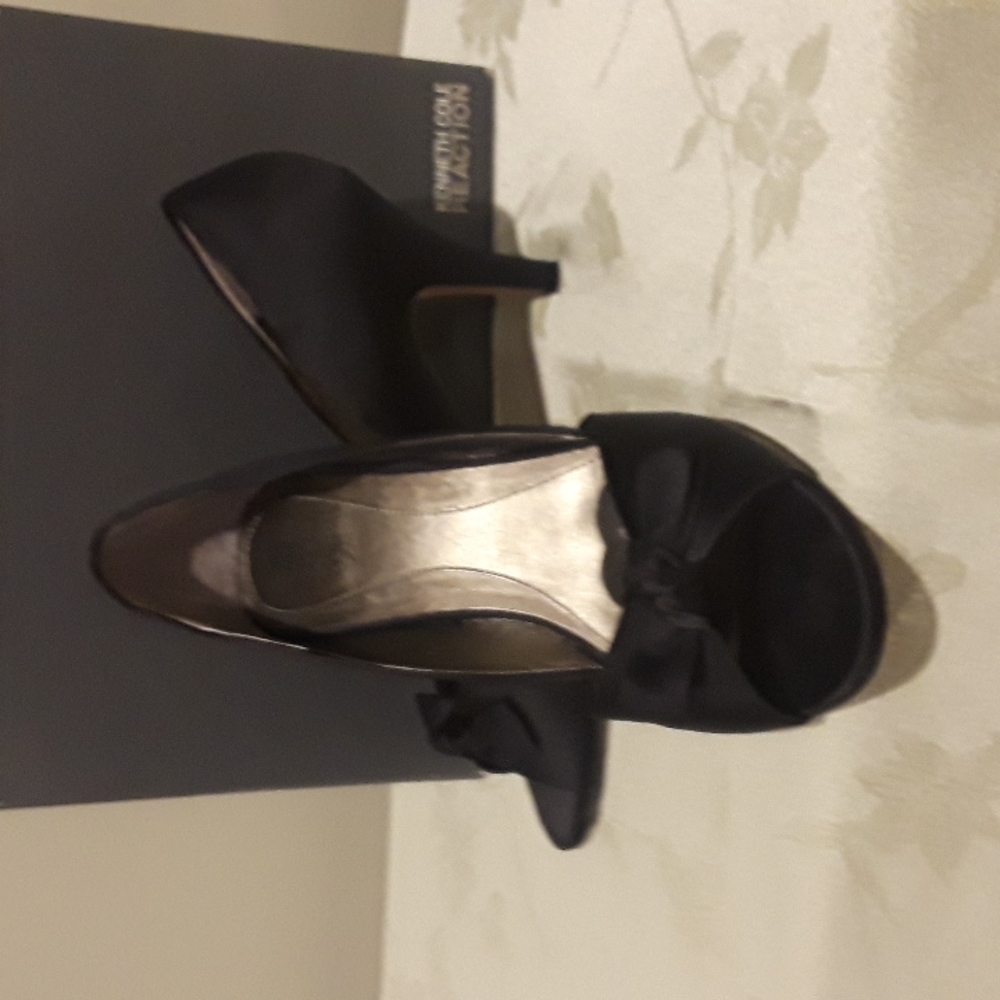 Black satin peep toe pumps.